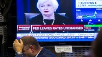 Fed hausse taux plus tard économie mondiale fragile